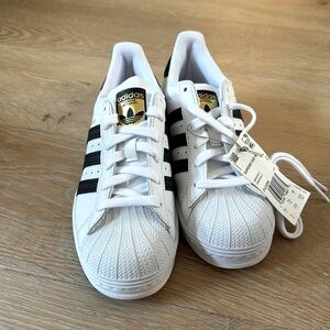 Adidas super star shoes.